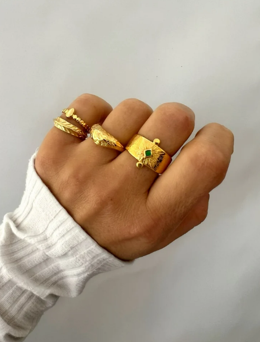 Gold ring with green stone price deals